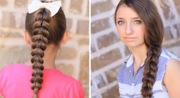 Penteado feminino trançado com estilo festivo e laço branco romântico