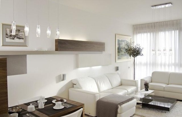 Sugestões de decoração para sala de estar-área de jantar-sofás de couro branco-madeira-mesa de jantar-prateleiras de parede