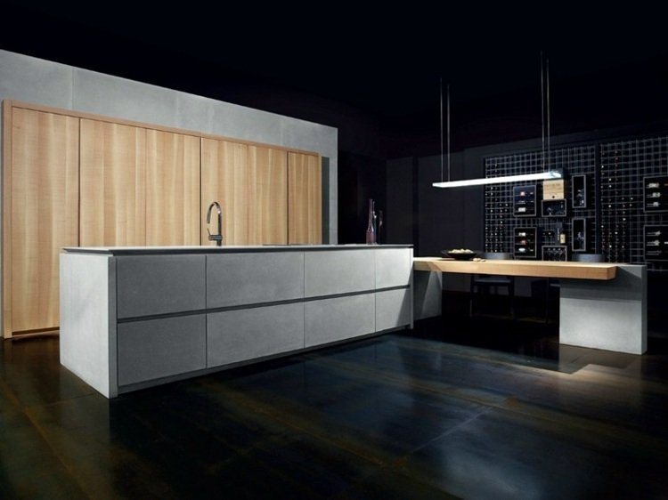 cozinha moderna embutida-fino-concreto-madeira-frentes-cozinha sem maçaneta-ilha-jantar-mesa-abajur-comer ponto