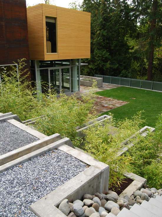 jardim minimalista de alvenaria de concreto fabricado industrialmente em uma encosta