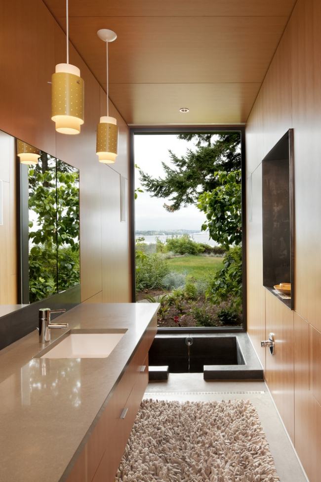 Tapete cerâmico da bancada do banheiro com banheira de hidromassagem pendente light-coates Design-Architects-Seattle