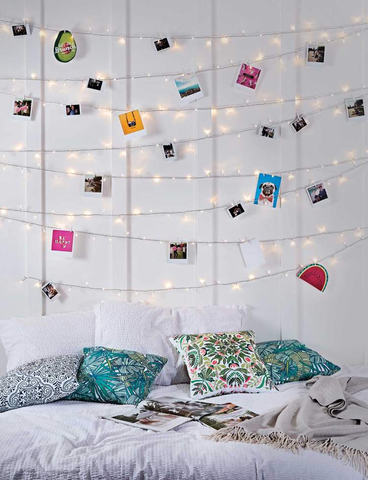 Projete uma parede de quadros. Pendure luzes de fada no quarto das meninas