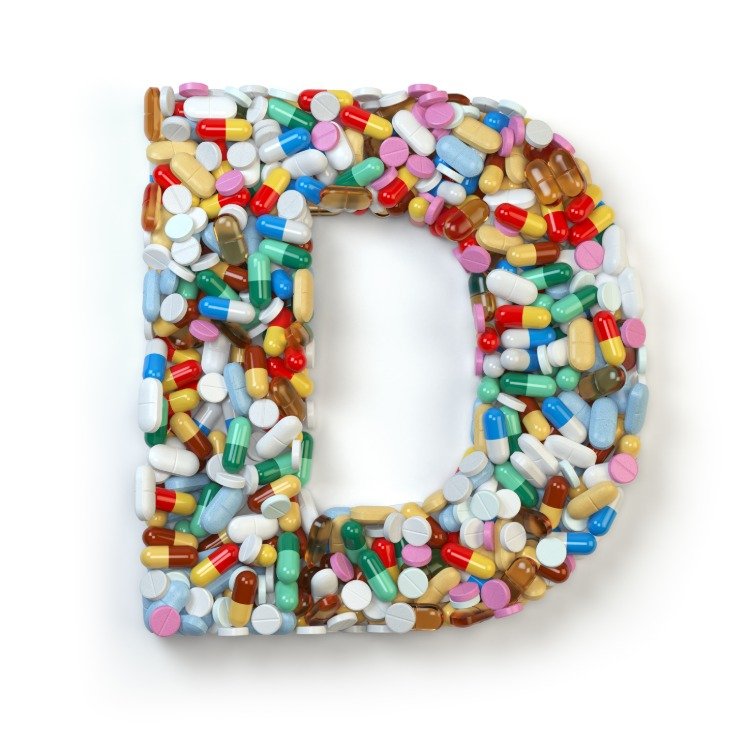 Suplementos dietéticos em cápsulas e medicamentos formam a letra da vitamina D