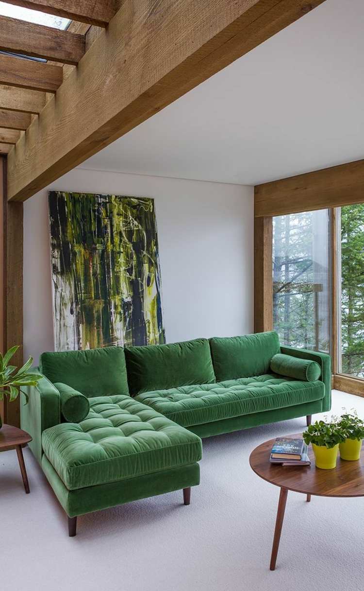 sofá de veludo verde de canto sofá mesa de centro redonda com vigas design interior moderno