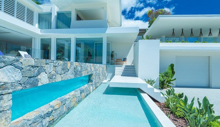 Combinação de piscina com janela de vidro acrílico e pedra natural