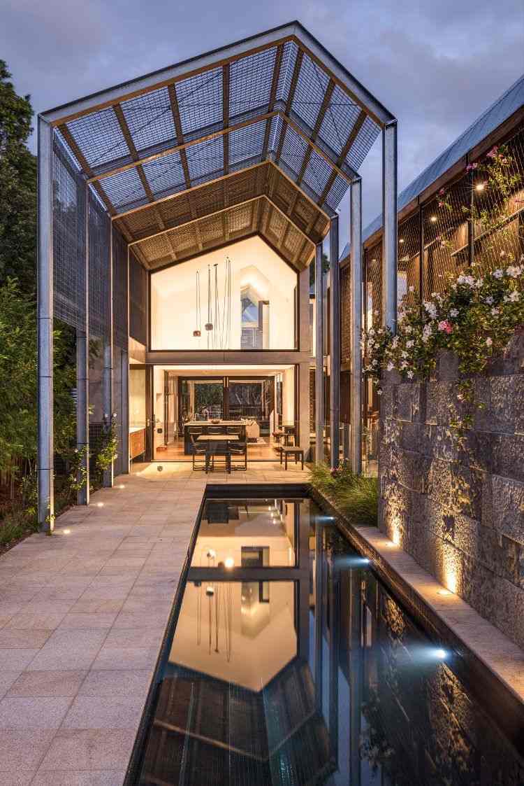 casa com anexo casa de donzela de ferro gable house designer arquitetos lagoa telhado passagem longitudinal