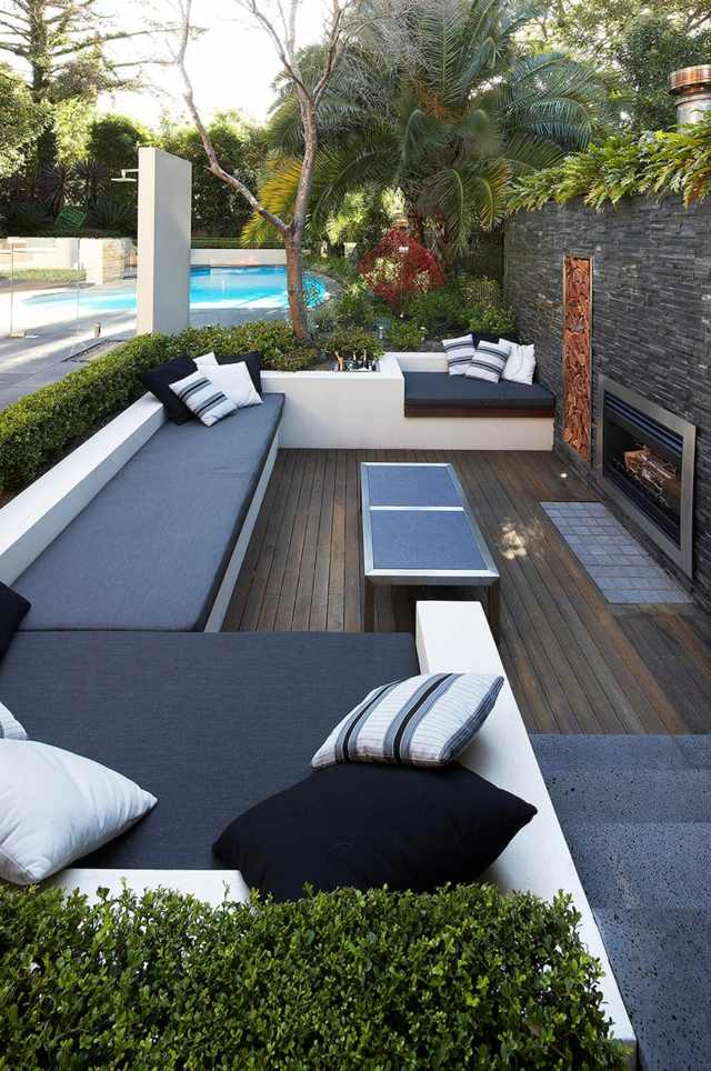 Design de área de estar, banco de concreto com lareira de madeira para jardim