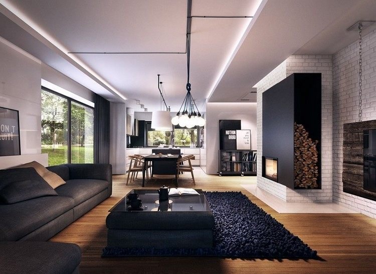 moderna-sala de estar-sofá-antracite-piso de madeira-carpete preto-parede com lareira