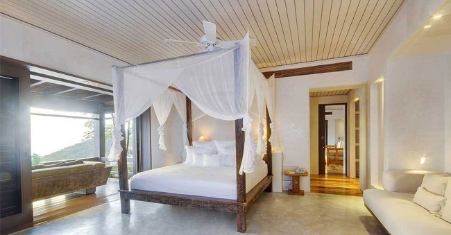 Villa Opium Mustique com terraço e cama com dossel