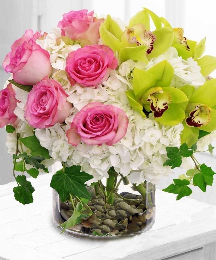 spring-decoration-glass-ideas-pebble-stones-hydrangeas-roses-orchids