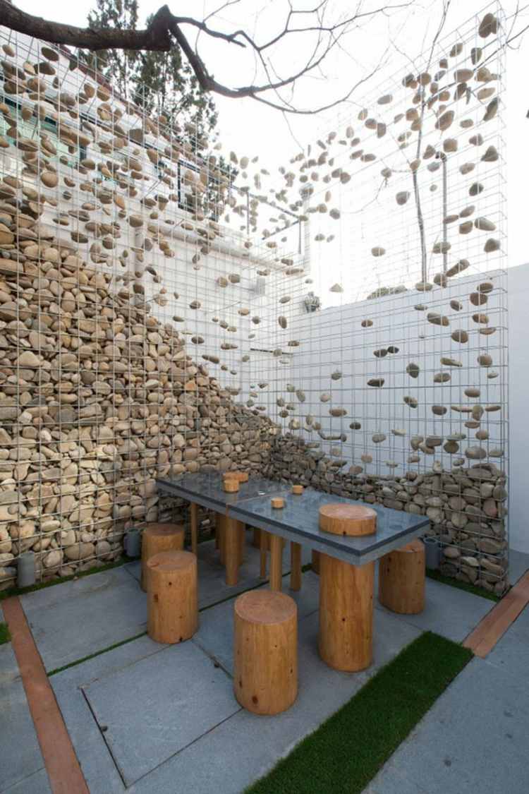 parede do terraço, área de estar, cerca de gabião, pedras, mesa de jantar
