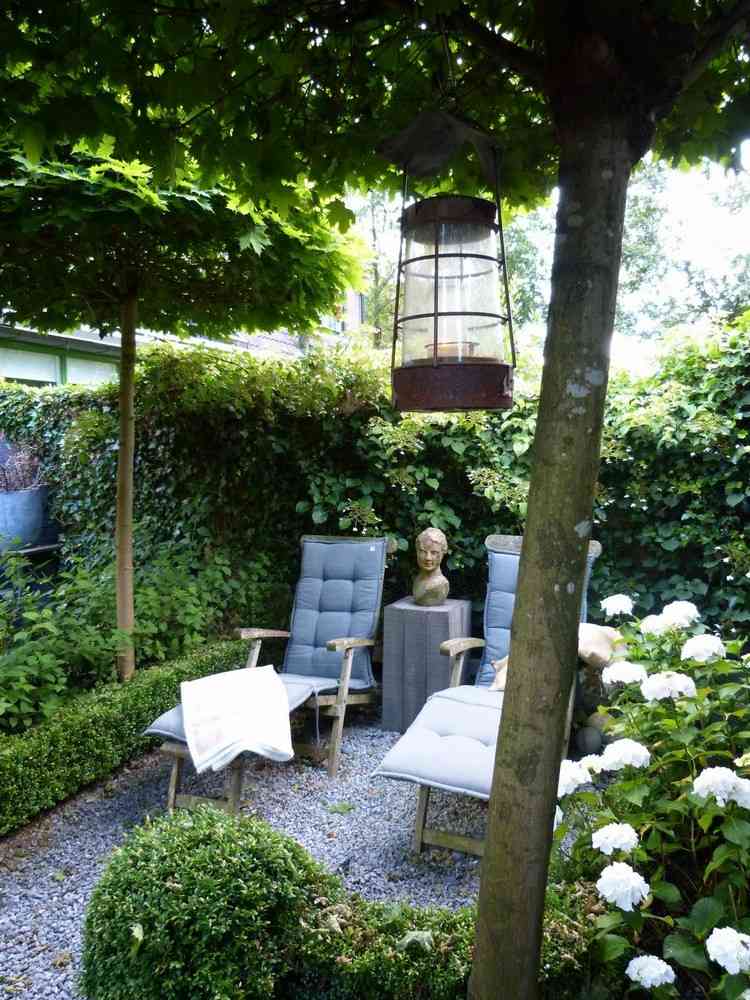 forma de canto de jardim plantas perenes assento espreguiçadeiras areia solo