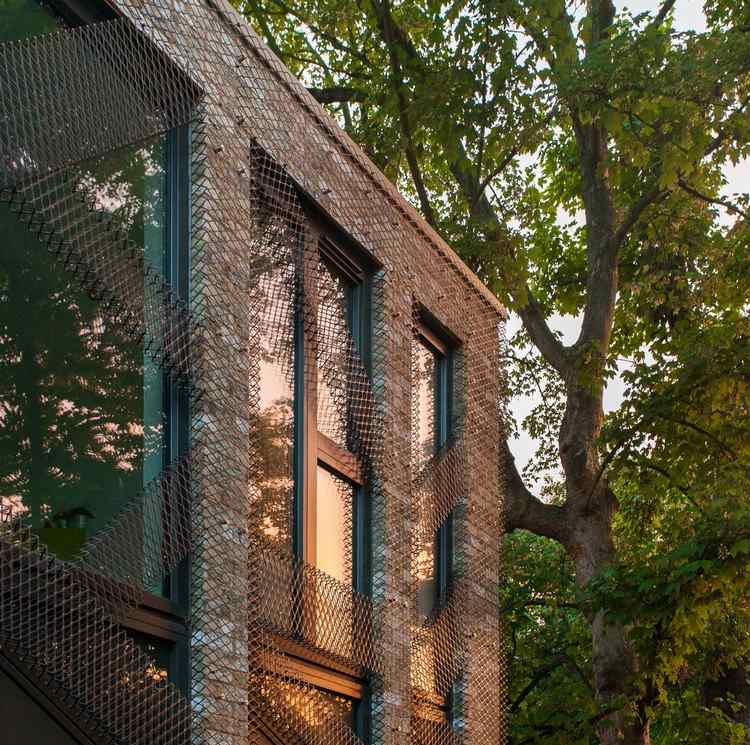 green-living-house-facade-big-window-park-tree
