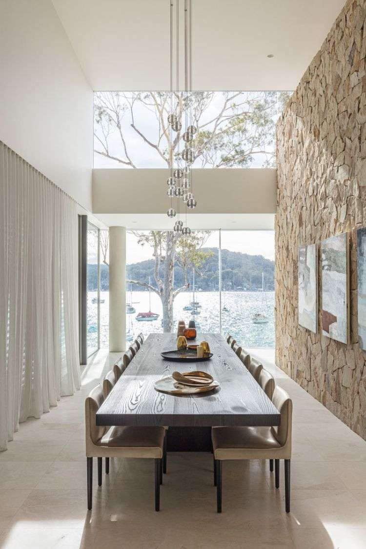 casa à beira da água comprar refúgio lote de terreno à beira do lago lugar de relaxamento zona do banco perto da costa vista externa vista lateral sala de jantar interna parede schlichstein