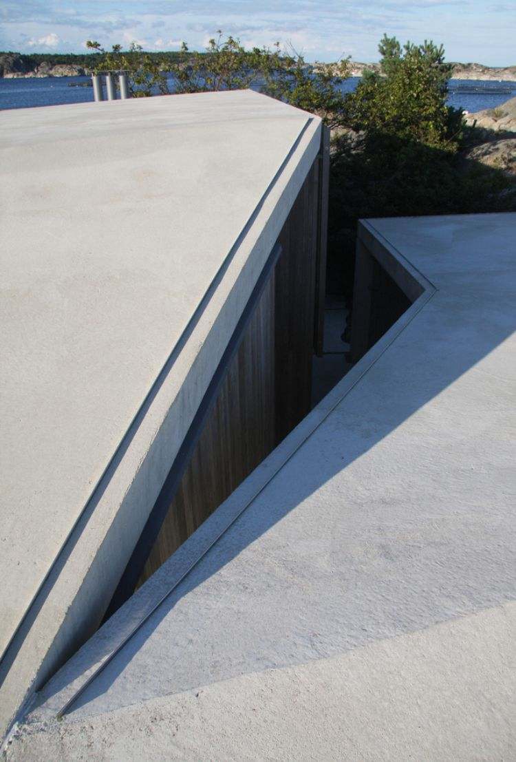 concreto telhado branco liso formas estranhas madeira vista mar