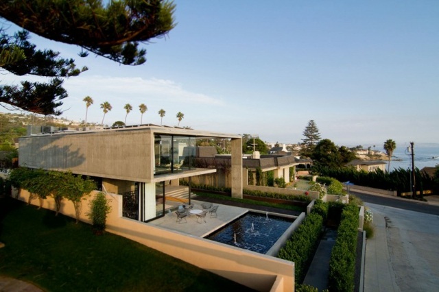 Casa de buxo de concreto com arquitetura moderna