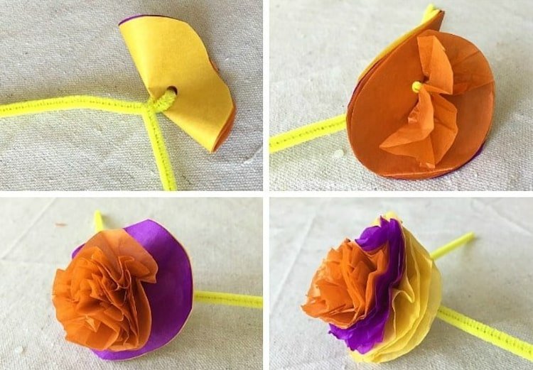 Flor colorida de papel de seda em um limpador de cachimbo
