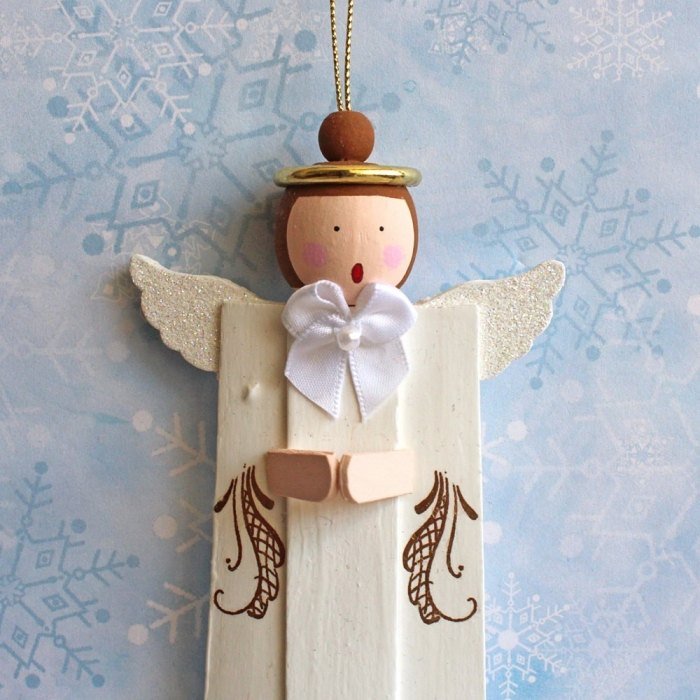 Decoração de Natal em madeira diy angel choir-for-the-advent-time-ideas-wood-logs-fir-tree-decoration