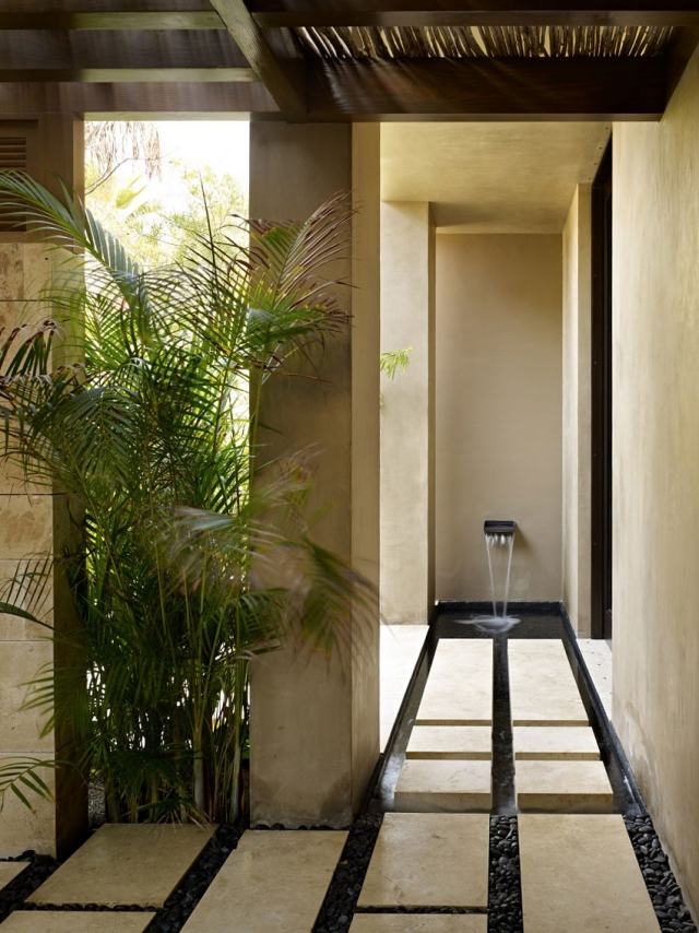 villa de férias luxo dentro fora projeto paisagem fonte palmeiras cascalho