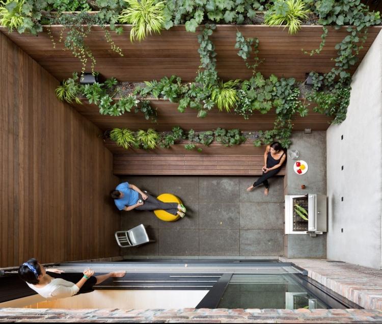 Terraço design-pátio-concreto-telhas-outdoor-grelha-madeira-banco-canteiros elevados