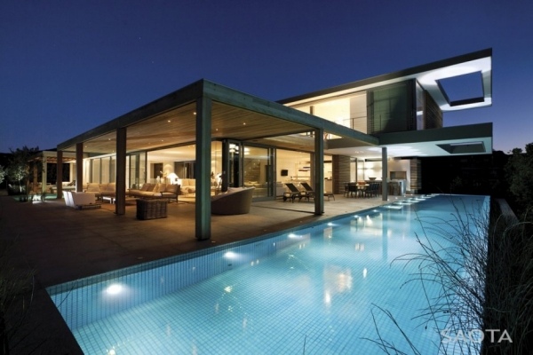 casa moderna com muita luz de vidro iluminação da piscina Saota da áfrica do sul
