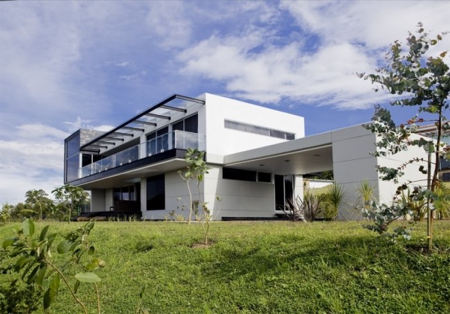 fachada da casa das palmas terraço de vidro branco carlos molina