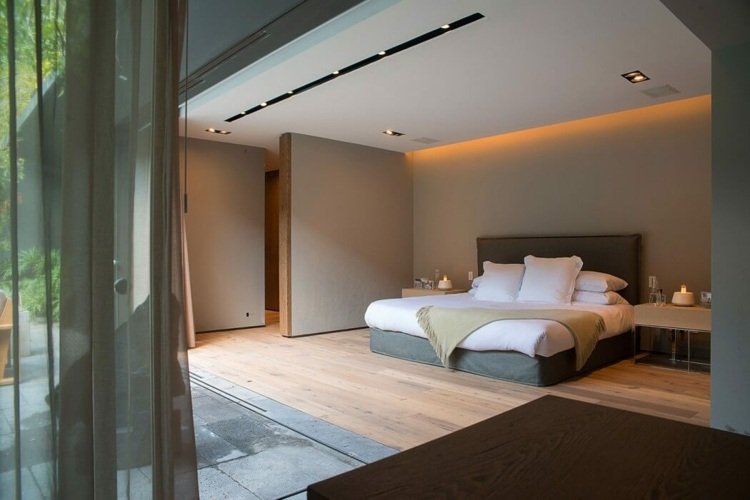 quarto design interior monocromático em cama cinza