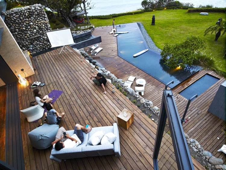 pedras naturais-pedregulhos-arquitetura moderna-terraço-lounge-jardim-piso de madeira