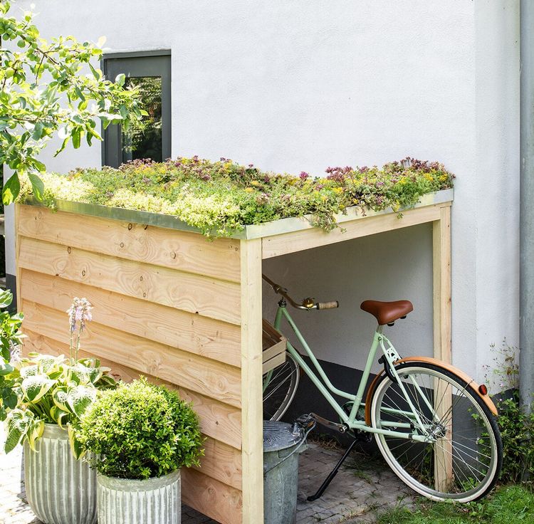 Garagens pequenas para bicicletas embelezam pontas verdes