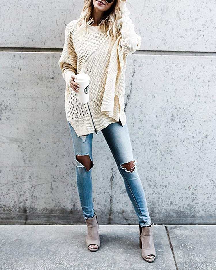 Suéter grande em marfim com jeans skinny e botins na ponta dos pés em cinza claro