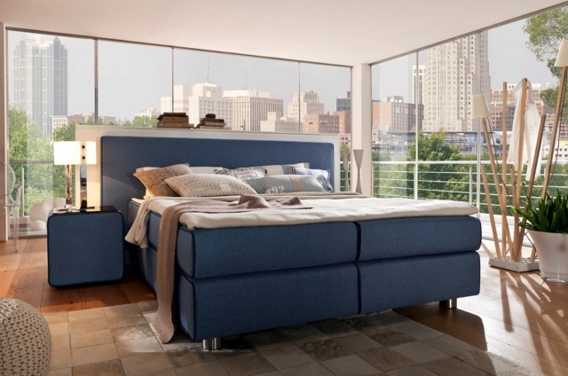 Design-in-blue-box-spring-bed-bedroom-with-walls-made-of-glass