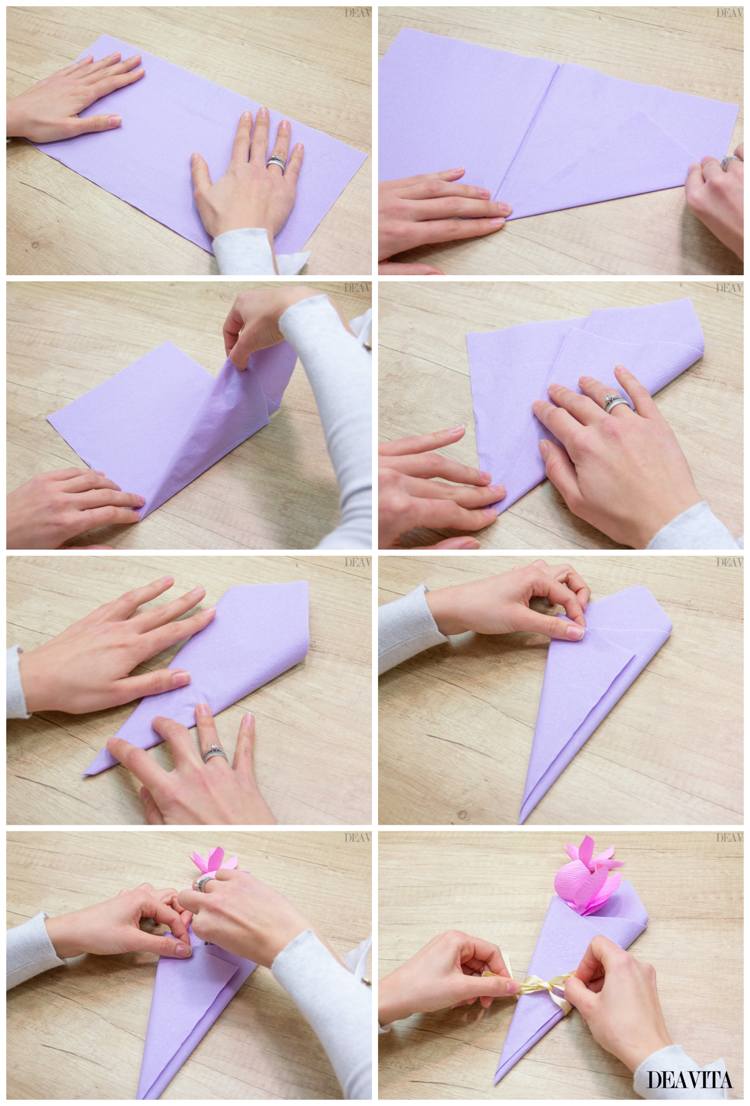 Guardanapos dobram buquê de flores, bolsa triangular, possivelmente também bolsa de talheres