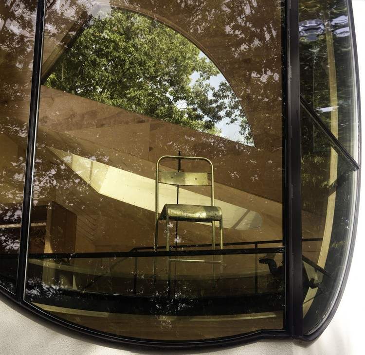solar house-wood-round-window-view-living-near to nature