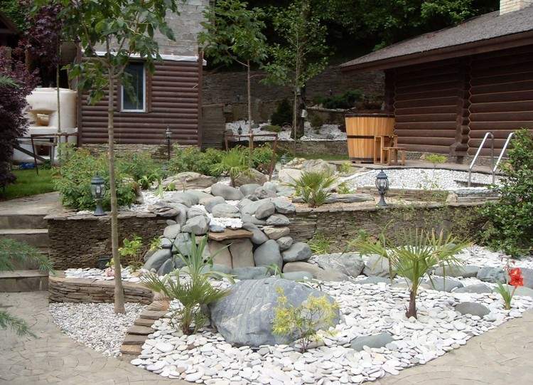 stone-bed-design-rock-garden-grey-rock-palm-trees