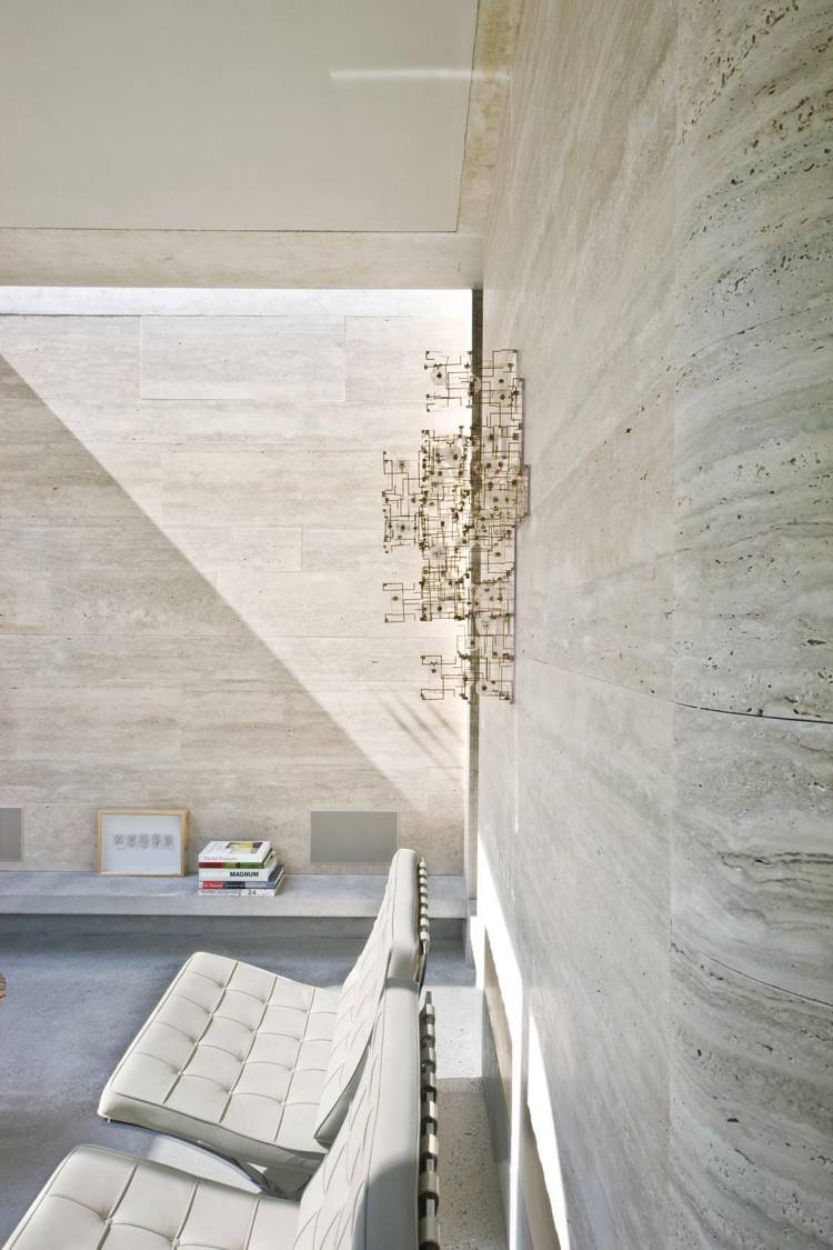parede de revestimento de pedra calcário incidência brilhante de piso de concreto leve minimalista