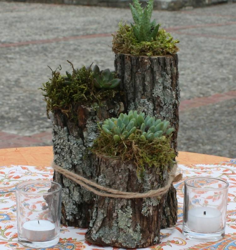 arranjo suculentas ramos de madeira vaso de flores vela toalha de mesa
