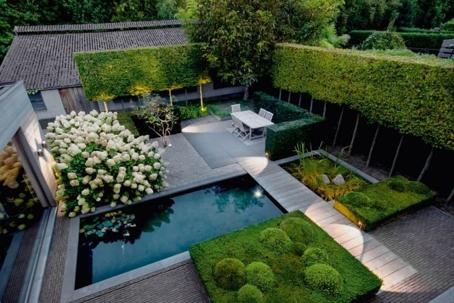 jardim iluminação ideias dicas piscina árvores altas sebes hortênsias brancas