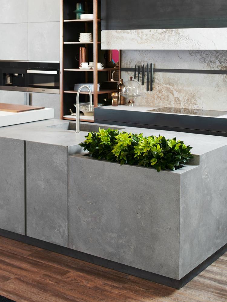 Ilha de cozinha em aparência de concreto com floreira embutida