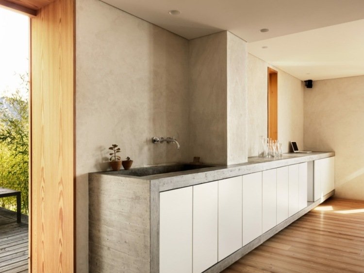 Estrutura de concreto para armários de cozinha minimalistas brancos