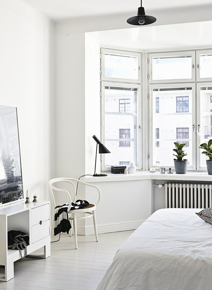 quarto design de estilo escandinavo cadeira cama branca